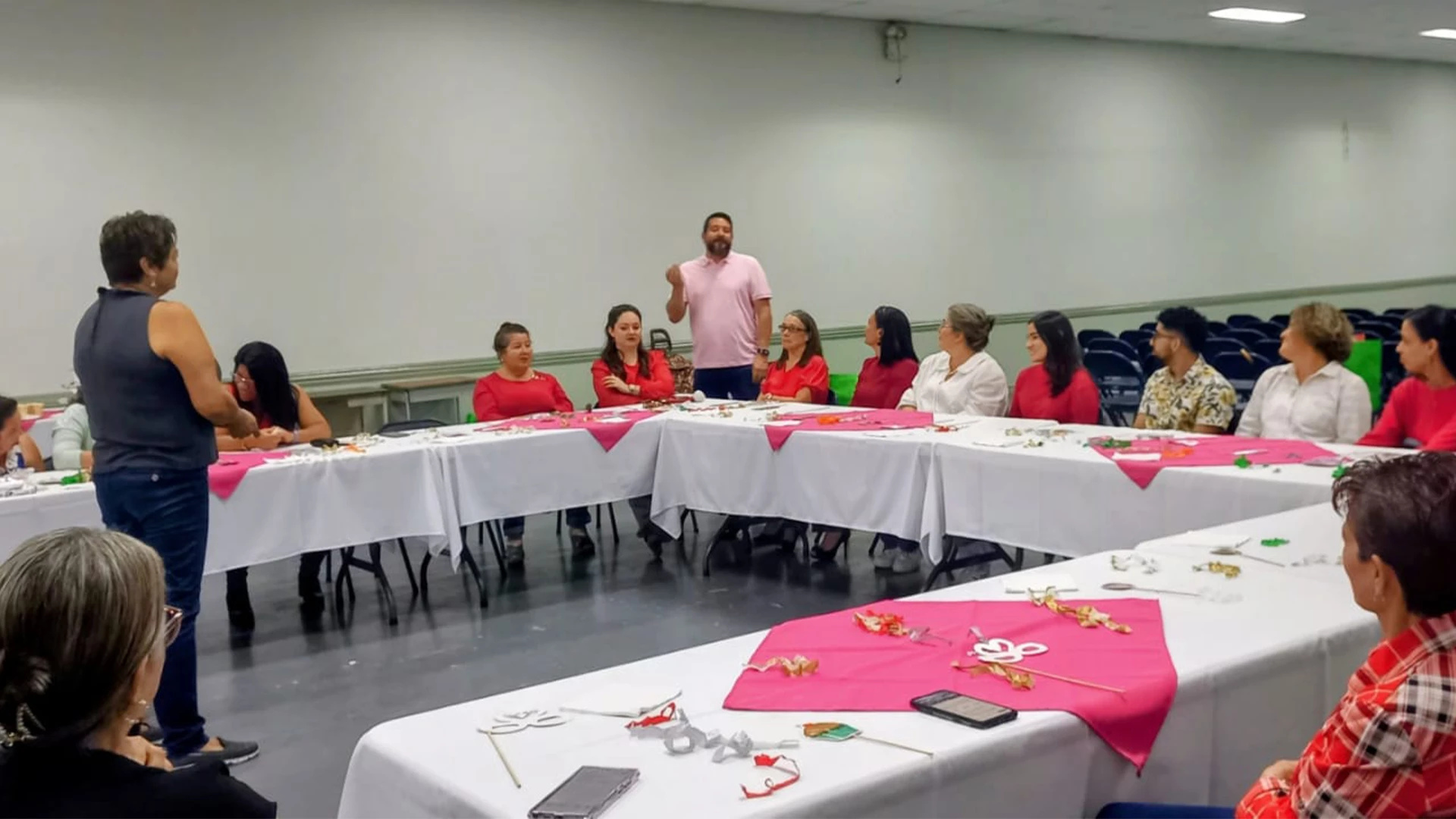 Participants gathered around tables during a ministry training session.